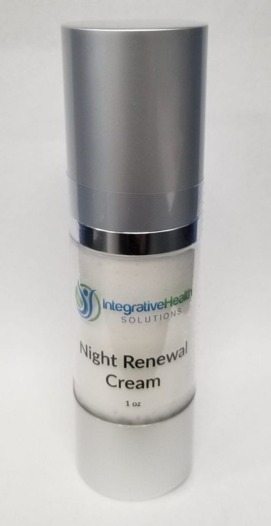 A bottle of cream that is sitting on the floor.