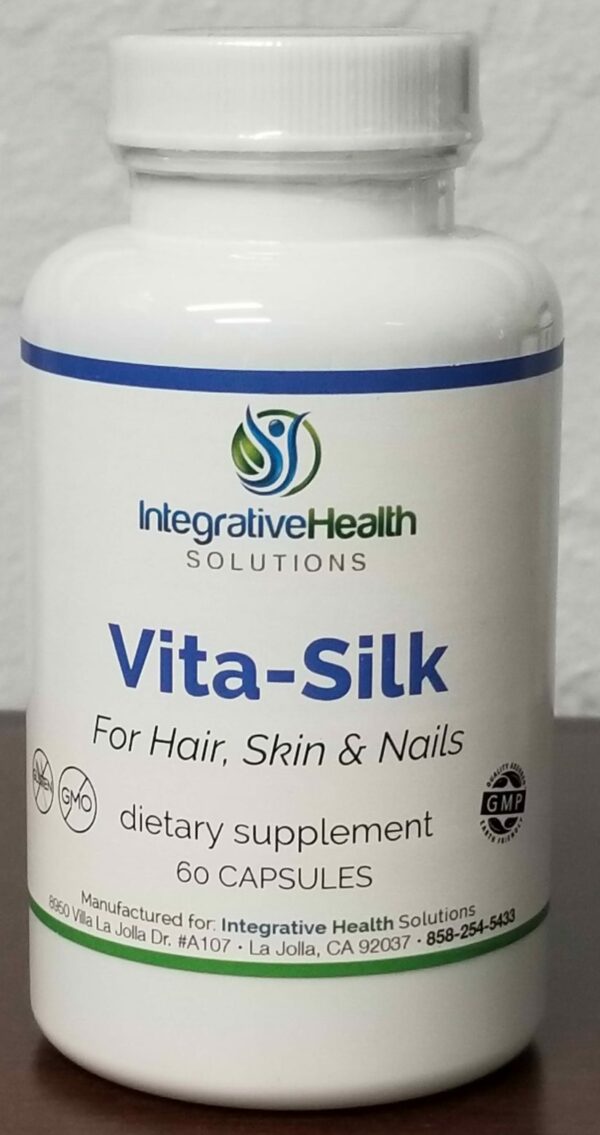A bottle of vita-silk supplement for hair, skin and nails.
