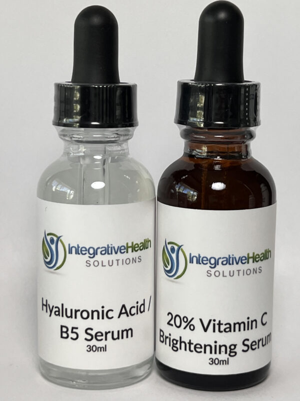 A bottle of serum and a bottle of vitamin c.